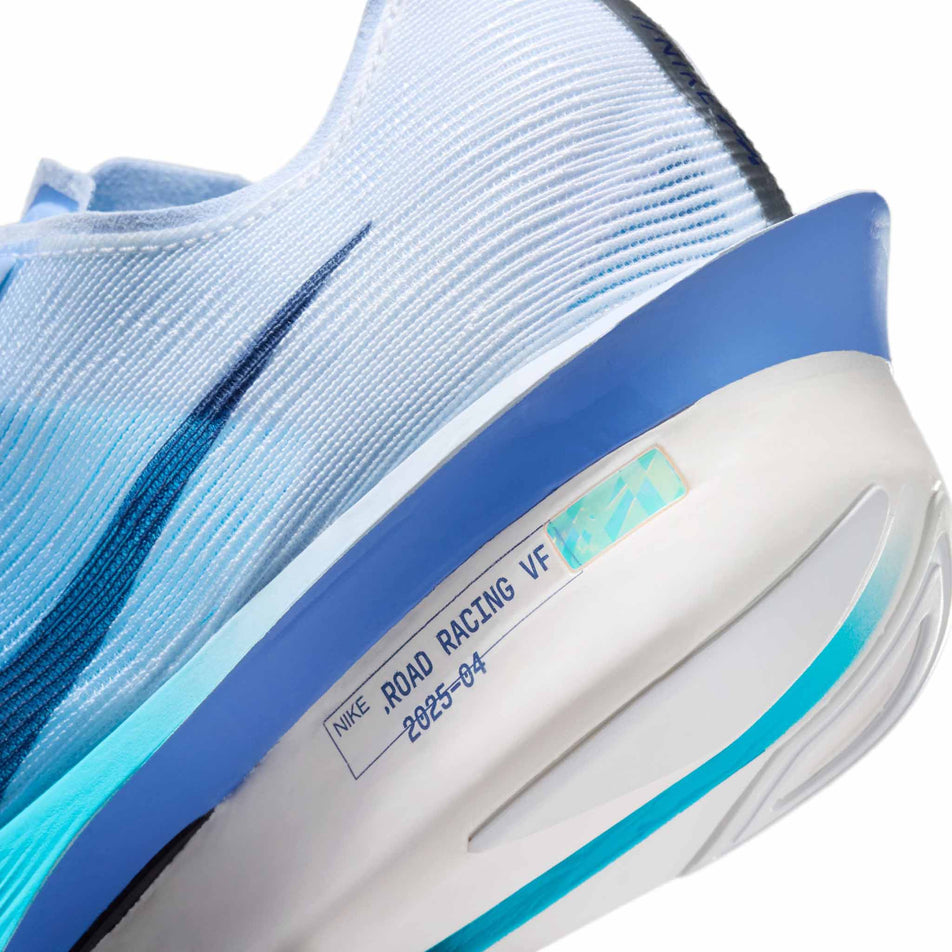 Close-up view of the rearfoot section of the left shoe from a pair of Nike Women's Vaporfly 4 Road Racing Shoes in the White/Midnight Navy-Hydrogen Blue colourway.