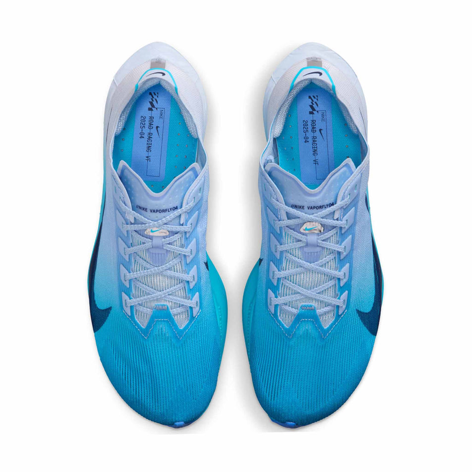 The uppers of a pair of Nike Women's Vaporfly 4 Road Racing Shoes in the White/Midnight Navy-Hydrogen Blue colourway.