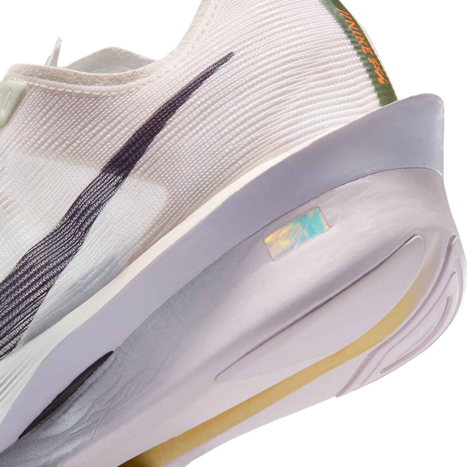 Close-up view of the rearfoot section of the left shoe from a pair of Nike Women's Vaporfly 4 Road Racing Shoes in the Barely Green/Purple Dynasty-Chalk colourway.
