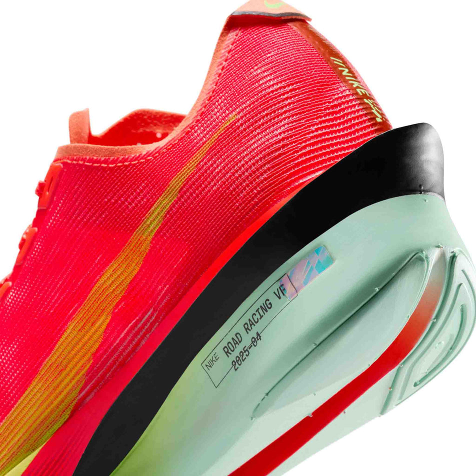 Close up of the midsole on the left shoe from a pair of Nike Women's Vaporfly 4 Road Racing Shoes in the Bright Crimson/Lime Blast-Mint Foam colourway. (8614579929250)