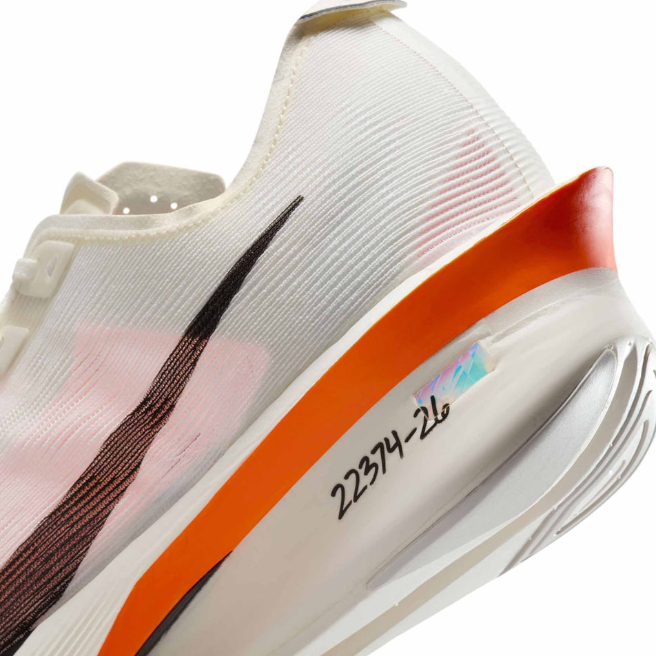 Close up of the wear-tester number on the lateral side of the left shoe from a pair of Nike Men's Vaporfly 4 Proto Road Racing Shoes in the Sail/Black-Total Orange-White colourway. (8635866808482)