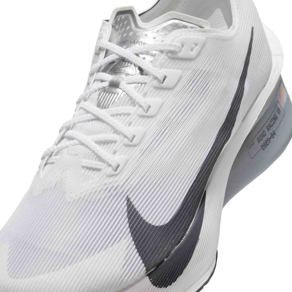 Close up of the upper of the left shoe from a pair of Nike Men's Vaporfly 4 Road Racing Shoes in the White/Gridiron-Obsidian Mist colourway. (8613796184226)