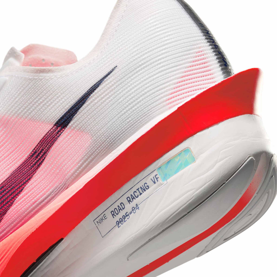 Close-up view of the rearfoot section of the left shoe from a pair of Nike Men's Vaporfly 4 Road Racing Shoes in the White/Midnight Navy-Bright Crimson colourway.