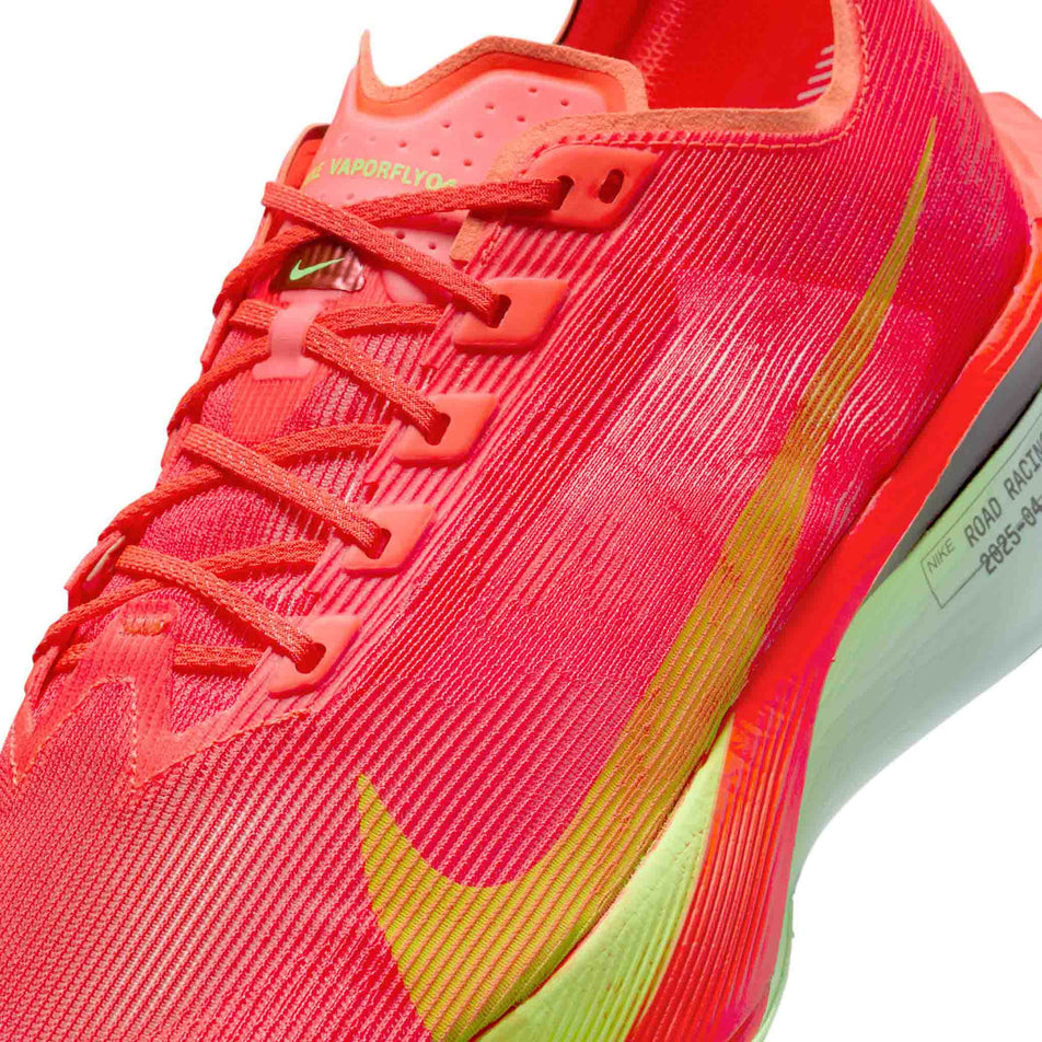Close up of the upper of the left shoe from a pair of Nike Men's Vaporfly 4 Road Racing Shoes in the Bright Crimson/Lime Blast-Mint Foam colourway. (8613801361570)