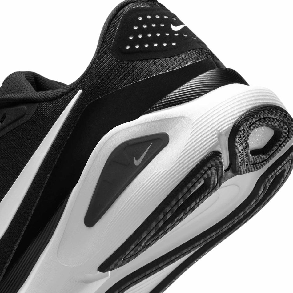Close up of the midsole of the left shoe from a pair of Nike Women's Structure 26 Road Running Shoes in the Black/White-Cool Grey-Metallic Silver colourway. (8686793982114)