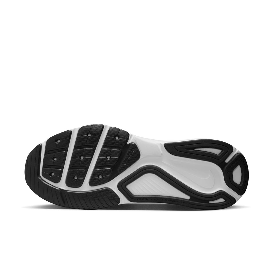 The outsole of the left shoe from a pair of Nike Women's Structure 26 Road Running Shoes in the Black/White-Cool Grey-Metallic Silver colourway. (8686793982114)