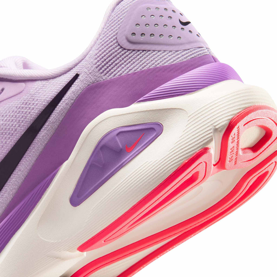 Close-up view of the rearfoot section of the left shoe from a pair of Nike Women's Structure 26 Road Running Shoes in the Violet Mist/Cave Purple-Bright Violet colourway.