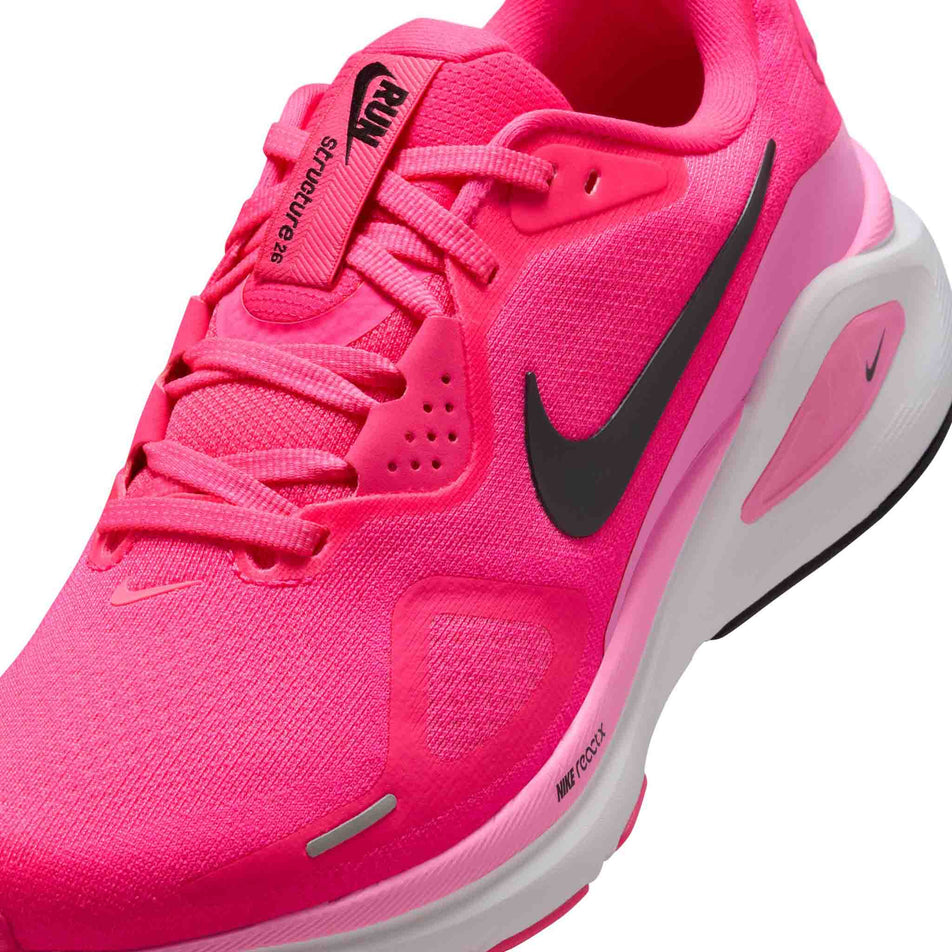 Close up of the upper of the left shoe from a pair of Nike Women's Structure 26 Road Running Shoes in the Hyper Pink/Black-Pink Spell-White colourway. (8686794997922)