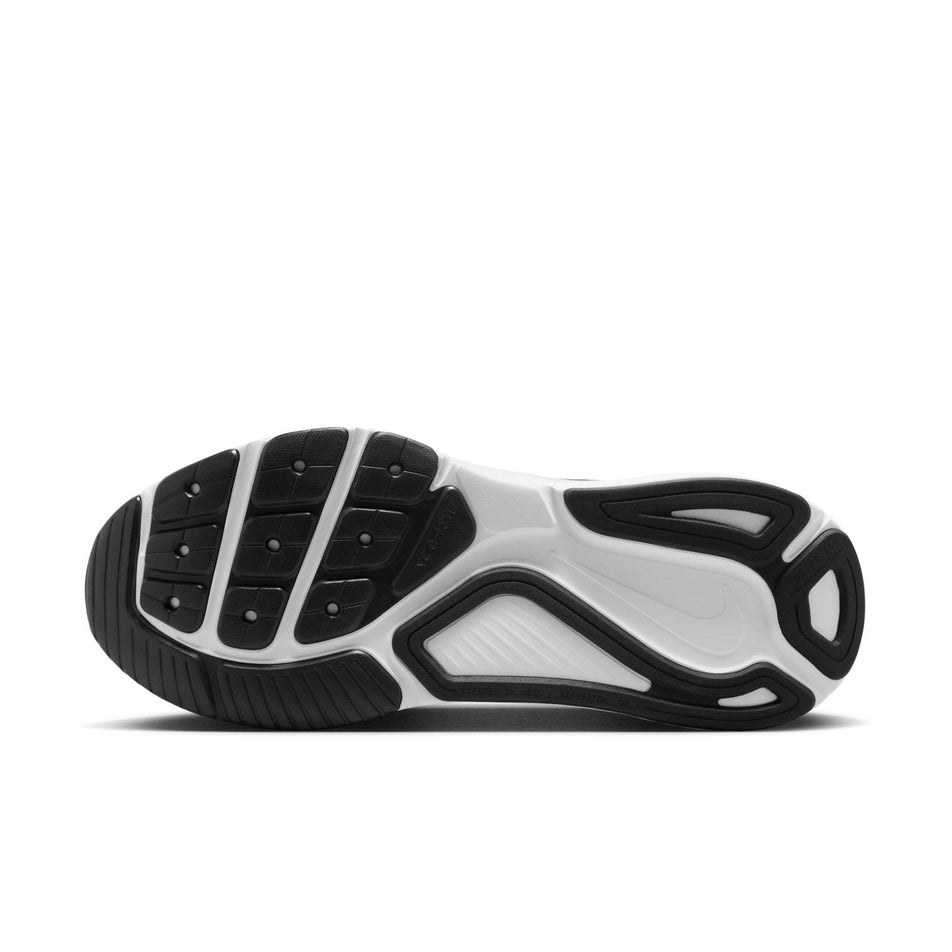 The outsole of the left shoe from a pair of Nike Men's Structure 26 Road Running Shoes in the Black/White-Cool Grey-Metallic Silver colourway. (8684582666402)