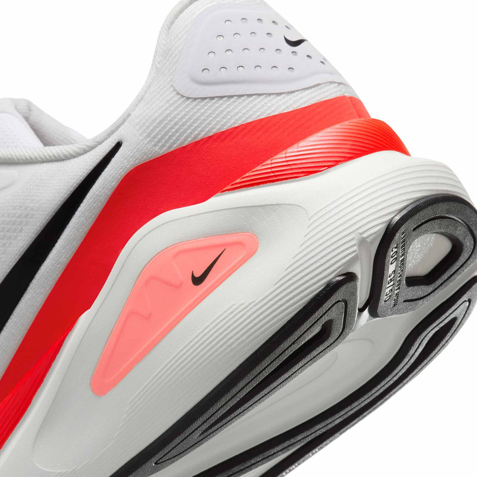 Close up of the midsole of the left shoe from a pair of Nike Men's Structure 26 Road Running Shoes in the White/Black-Bright Crimson-Photon Dust colourway. (8684589973666)