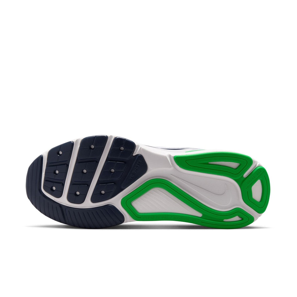 The outsole of the left shoe from a pair of Nike Men's Structure 26 Road Running Shoes in the White/Midnight Navy-Green Spark colourway.