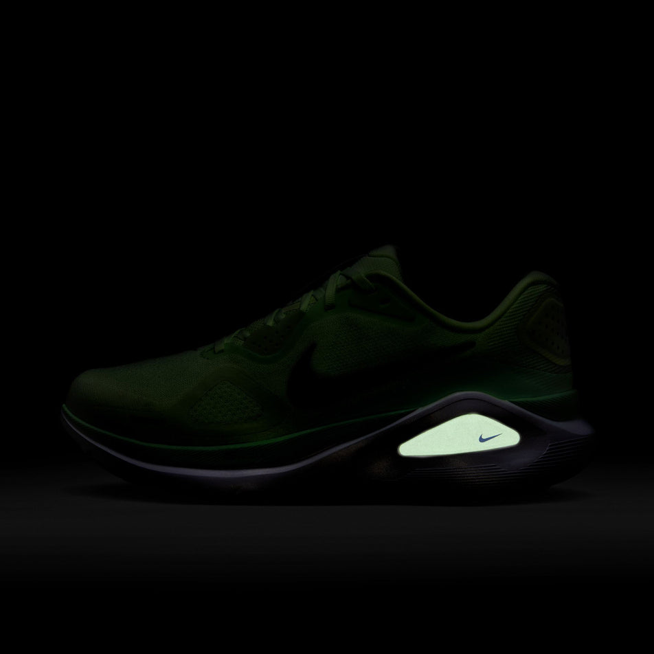 The reflective graphics on the left shoe from a pair of Nike Men's Structure 26 Road Running Shoes in the Volt Tint/Black Spruce-Lime Blast colourway.