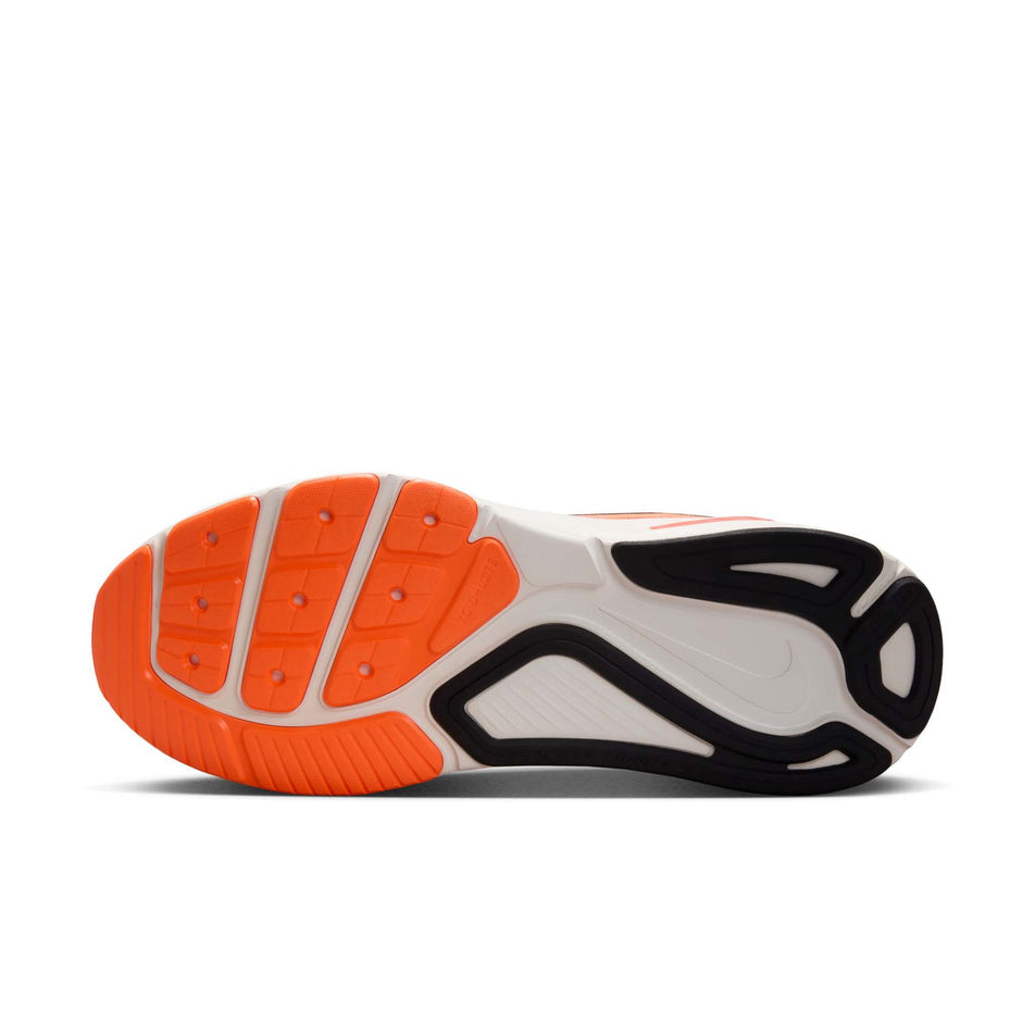 The outsole of the left shoe from a pair of Nike Men's Structure 26 Road Running Shoes in the Total Orange/Black-Total Crimson Chalk colourway. (8723638255778)