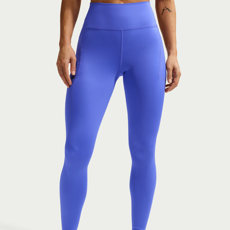 Front view of a model wearing the Nike Women's Swift High-Waisted 7/8 Running Leggings in the Sapphire/Reflective Silver colourway.