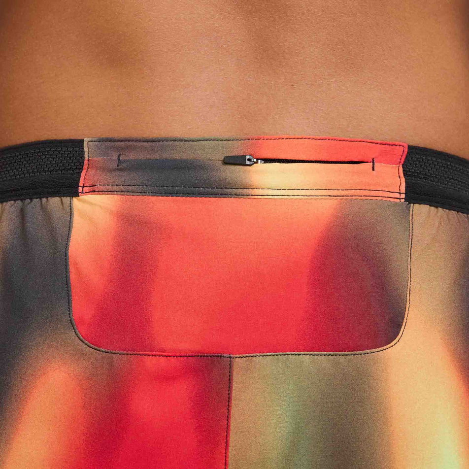 The zip pocket on the back of the Nike Men's Dri-FIT AeroSwift Elite Entry Shorts in the Light Lemon Twist  colourway. (8574140317858)