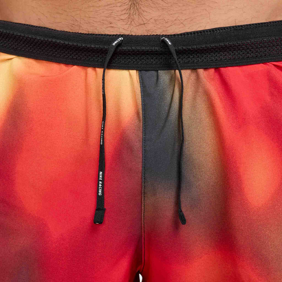 The drawcord on the Nike Men's Dri-FIT AeroSwift Elite Entry Shorts in the Light Lemon Twist  colourway. (8574140317858)