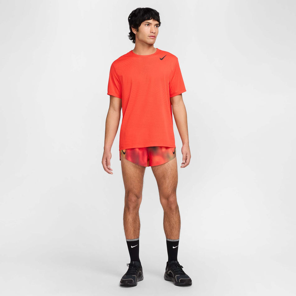 Front view of a model wearing the Nike Men's Dri-FIT AeroSwift Elite Entry Shorts in the Light Lemon Twist  colourway. (8574140317858)