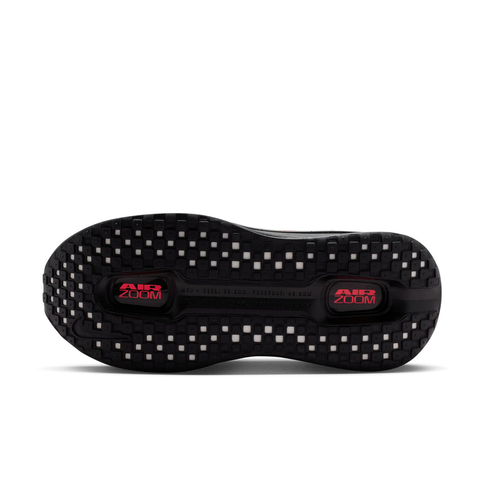 The outsole of the left shoe from a pair of Nike Women's Vomero Premium Road Running Shoes in the Black/Sapphire-Hot Lava-Anthracite colourway.