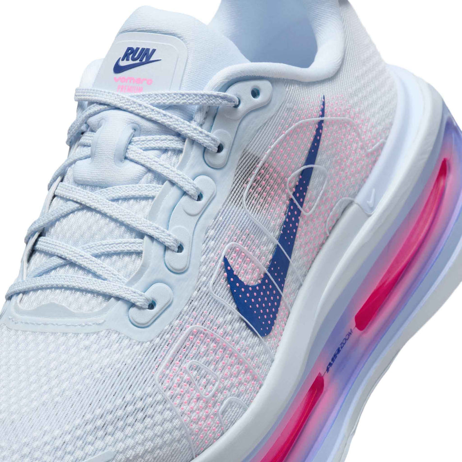 Close-up view of the upper of the left shoe from a pair of Nike Women's Vomero Premium Running Shoes in the Blue Tint/Deep Royal Blue-Aluminum colourway. (8756155809954)
