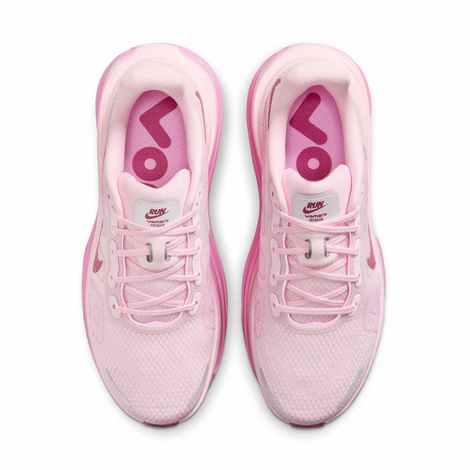 The uppers of a pair of Nike Women's Vomero Premium Road Running Shoes in the Pink Foam/Pink Smoke-Pink Rise colourway.