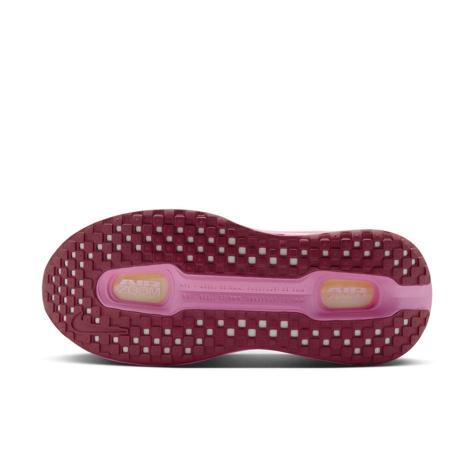 The outsole of the left shoe from a pair of Nike Women's Vomero Premium Road Running Shoes in the Pink Foam/Pink Smoke-Pink Rise colourway.