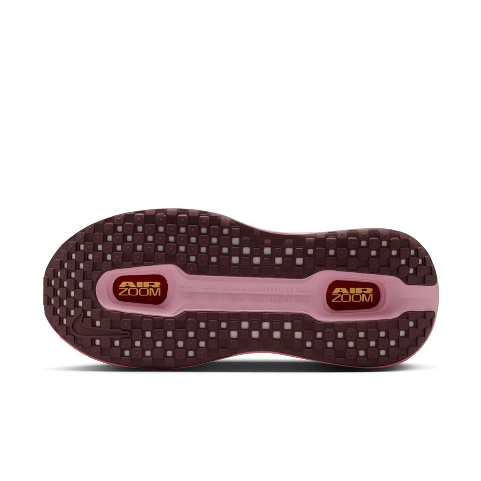 The outsole of the left shoe from a pair of Nike Women's Vomero Premium Road Running Shoes in the Tangerine Tint/Tattoo-Bright Crimson colourway.