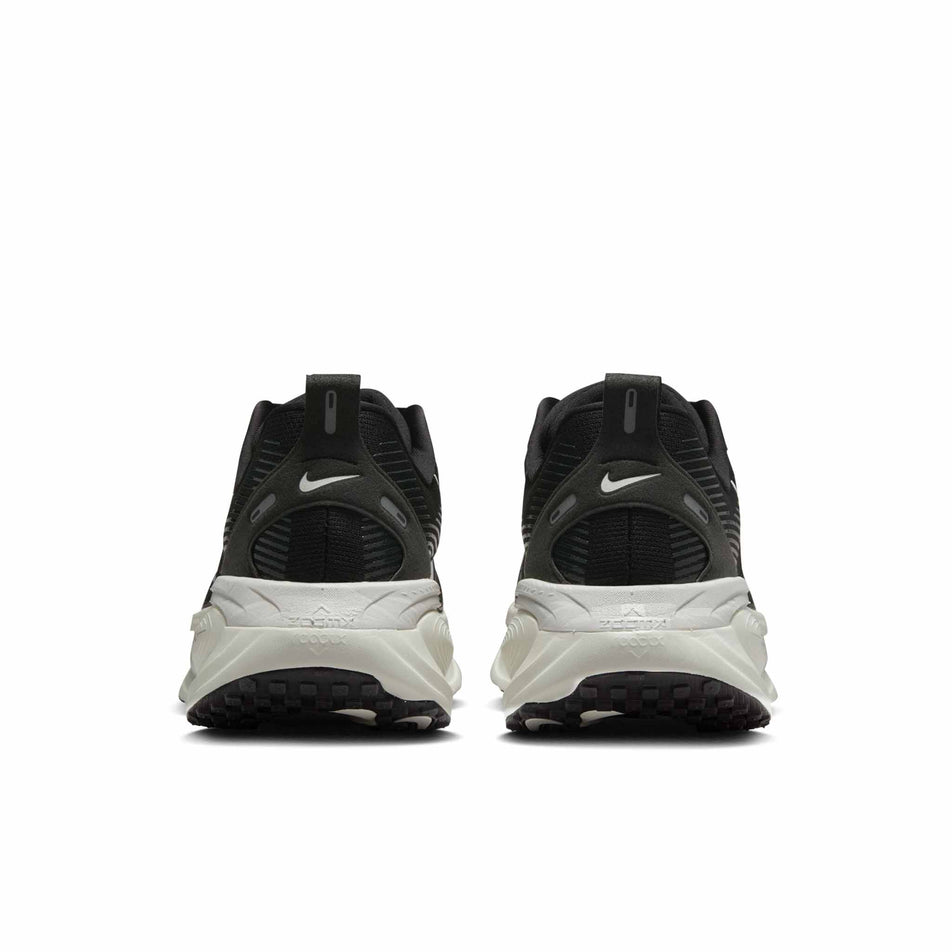The back of a pair of Nike Men's Vomero 18 Road Running Shoes in the Black/Summit White-Coconut Milk colourway. (8684566708386)