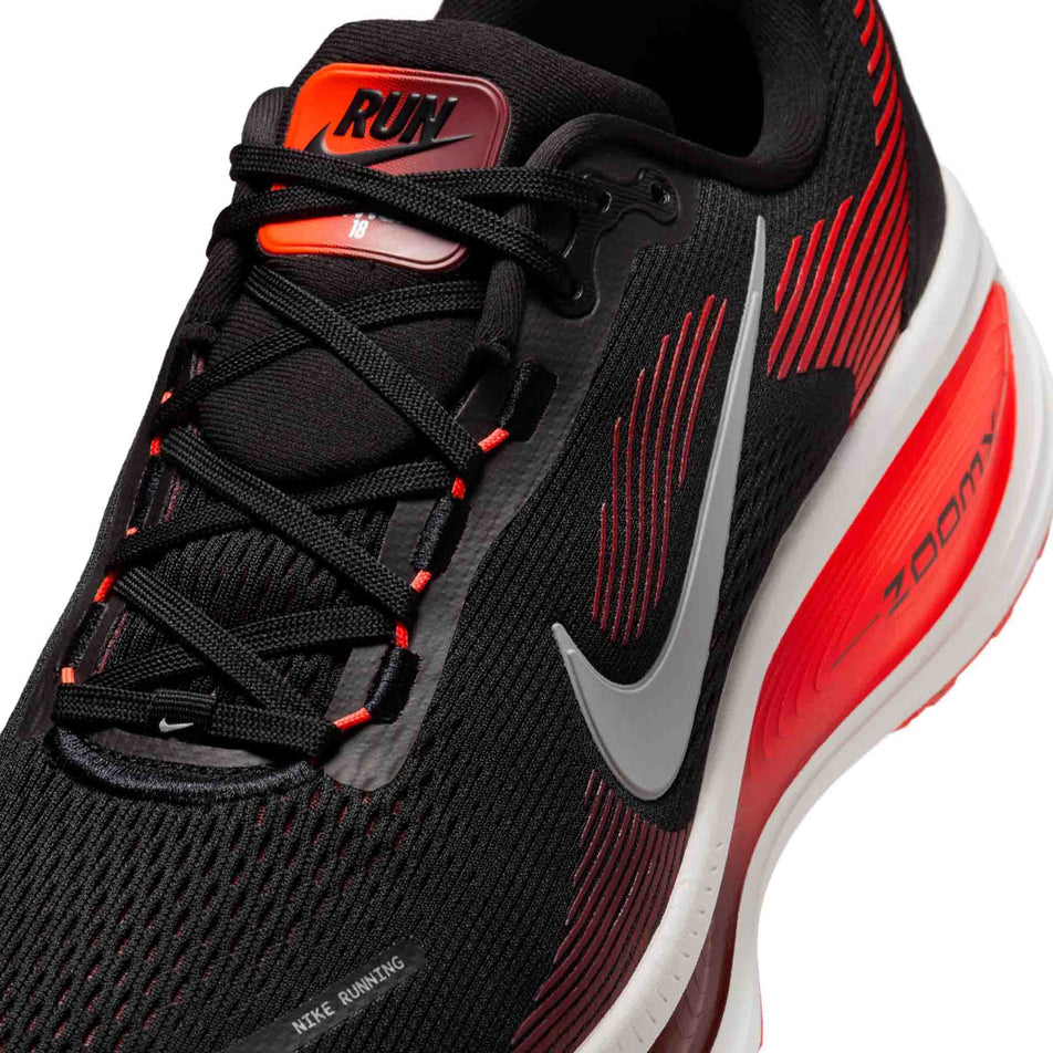 Close up of the upper of the left shoe from a pair of Nike Men's Vomero 18 Road Running Shoes in the Black/Summit White-Bright Crimson colourway. (8684579061922)
