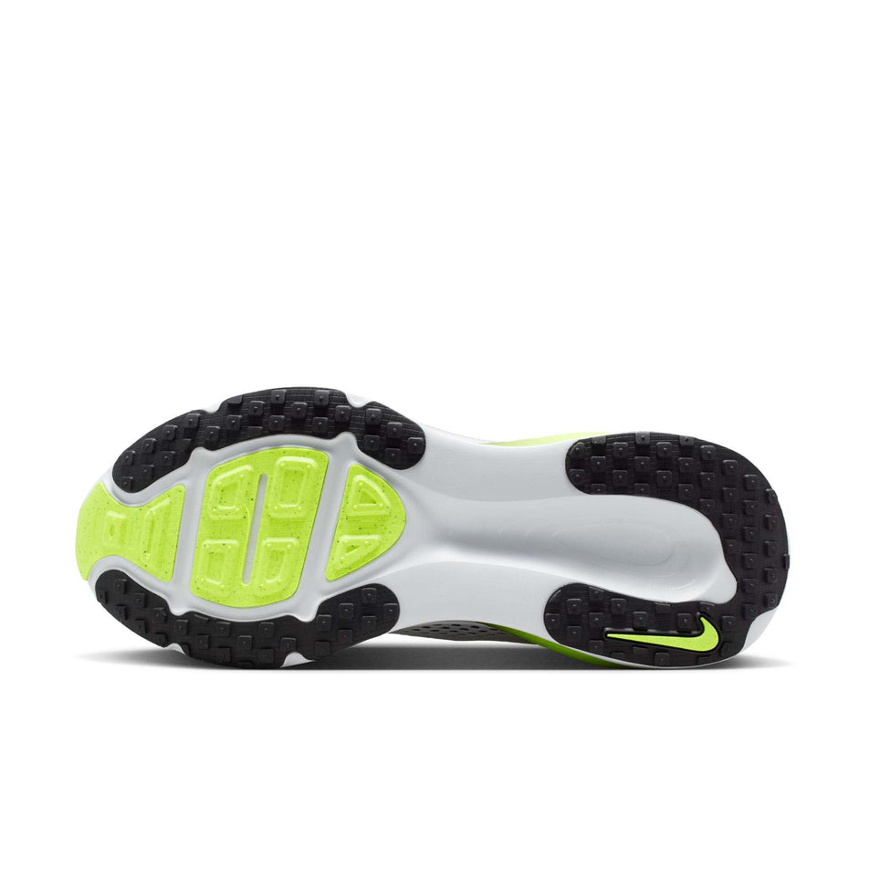 The outsole of the left shoe from a pair of Nike Men's Vomero 18 Road Running Shoes in the Photon Dust/Black-Volt colourway.