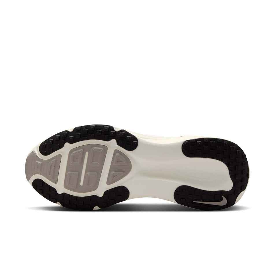 The outsole on the left shoe from a pair of Nike Men's Vomero 18 Road Running Shoes in the Summit White/Black-Coconut Milk colourway. (8574627086498)