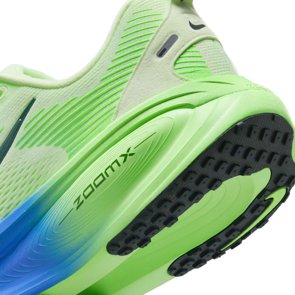 Close-up view of the rearfoot of the left shoe from a pair of Nike Men's Vomero 18 Road Running Shoes in the White/Black Spruce-Volt Tint-Sapphire colourway.