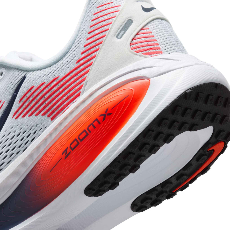 Close-up view of the rearfoot section of the left shoe from a pair of Nike Men's Vomero 18 Road Running Shoes in the White/Midnight Navy-Bright Crimson-Black colourway.