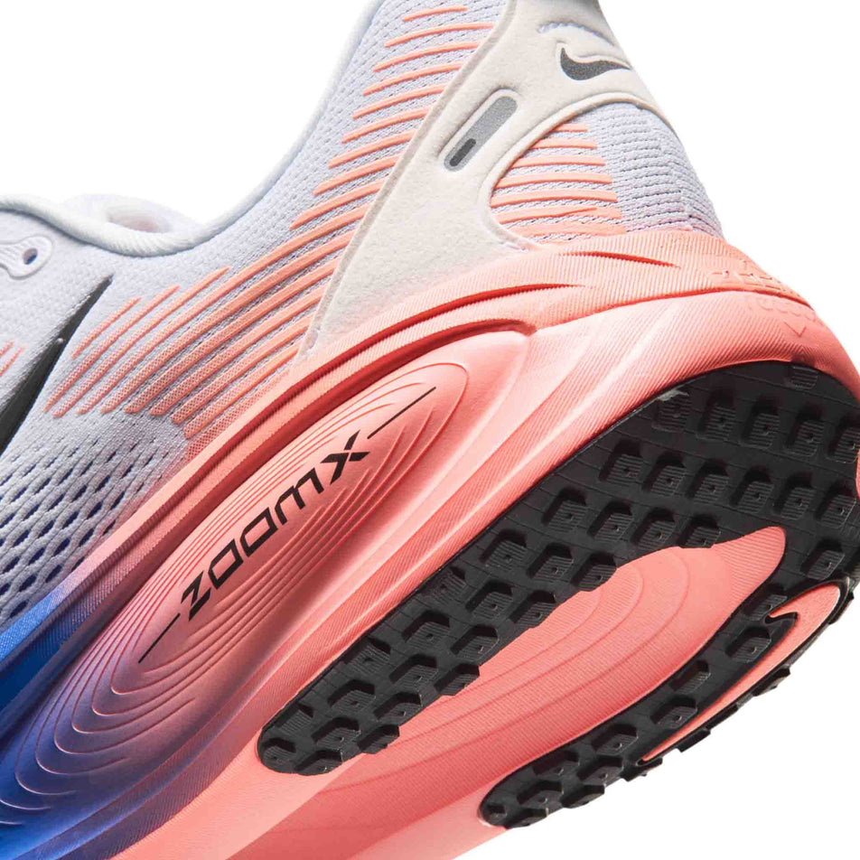 Close-up view of the rearfoot section of the left shoe from a pair of Nike Men's Vomero 18 Road Running Shoes in the White/Black-Racer Blue-Atomic Pink colourway.