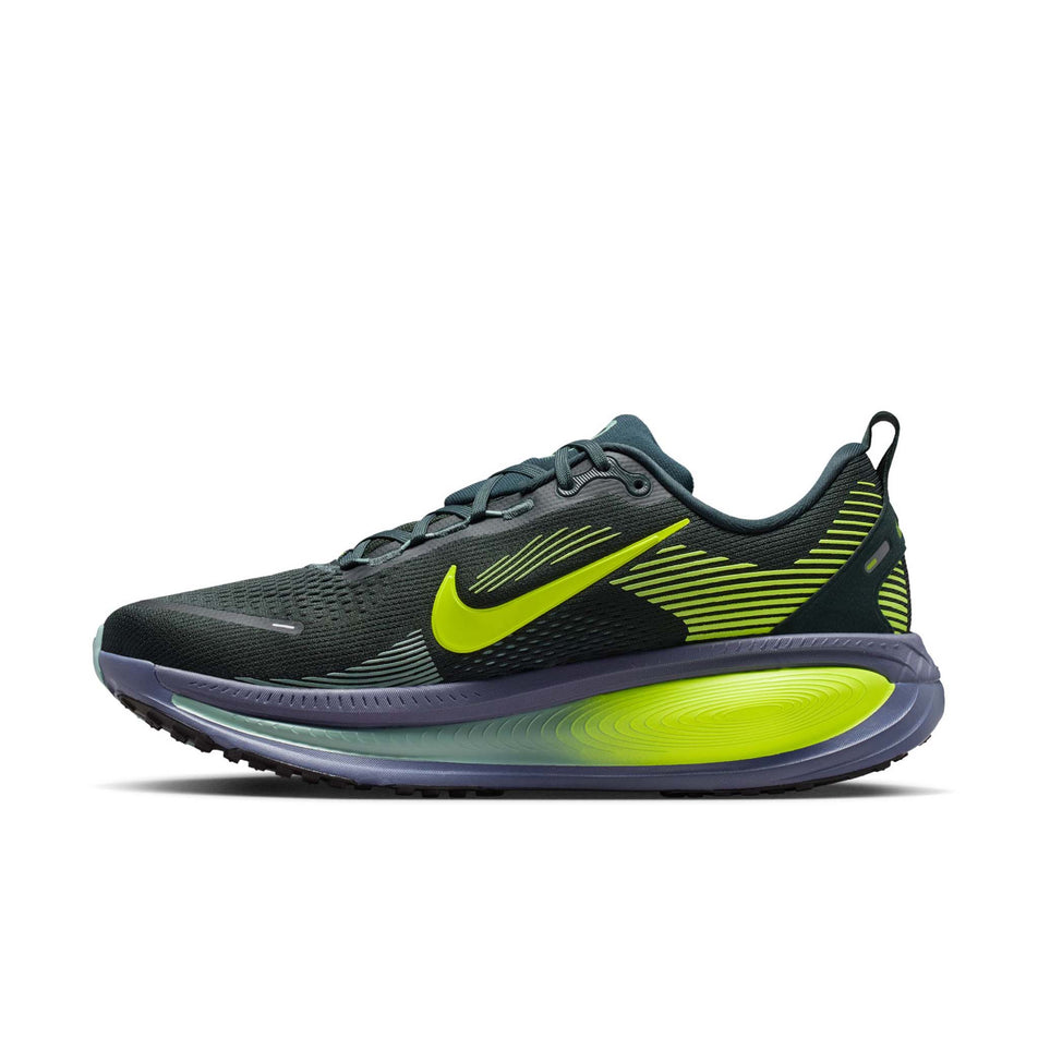 Medial view of the right shoe from a pair of Nike Men's Vomero 18 Road Running Shoes in the Seaweed/Volt-Cannon-Sanded Purple colourway.