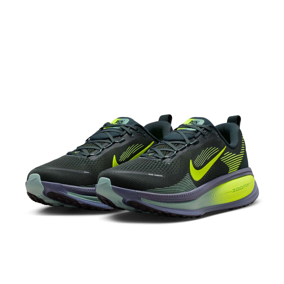 A pair of Nike Men's Vomero 18 Road Running Shoes in the Seaweed/Volt-Cannon-Sanded Purple colourway.