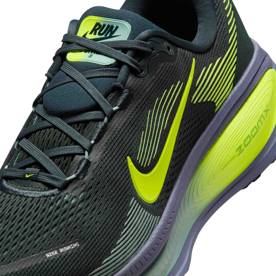 Close-up view of the upper of the left shoe from a pair of Nike Men's Vomero 18 Road Running Shoes in the Seaweed/Volt-Cannon-Sanded Purple colourway.
