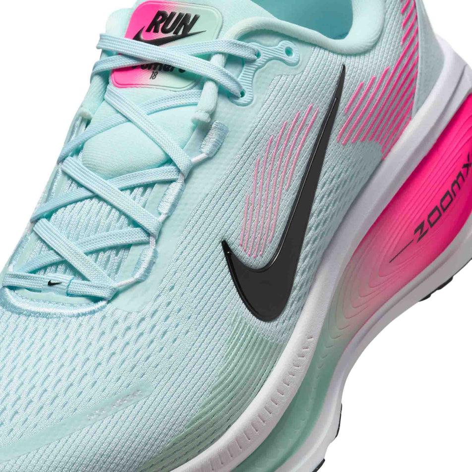 Close up of the upper of the left shoe from a pair of Nike Men's Vomero 18 Road Running Shoes in the Glacier Blue/Black-White-Hyper Pink colourway. (8684580896930)