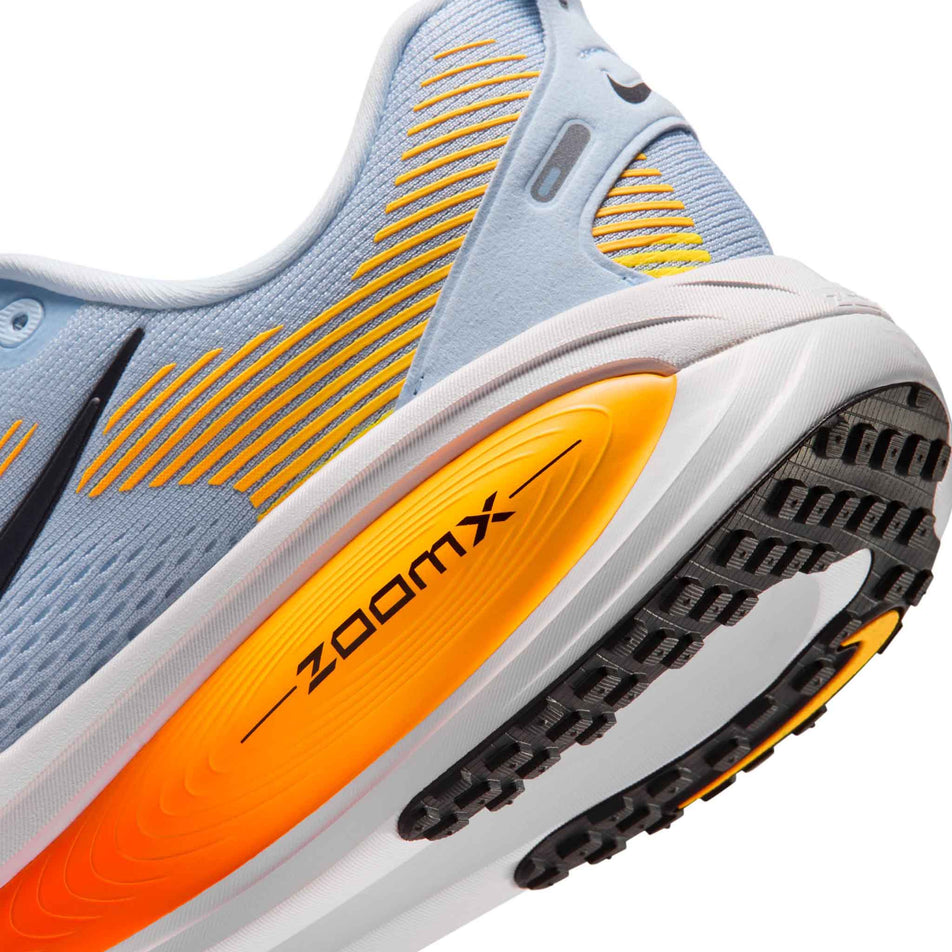 Close-up view of the rearfoot section of the left shoe from a pair of Nike Men's Vomero 18 Road Running Shoes in the Hydrogen Blue/Black-Laser Orange colourway.