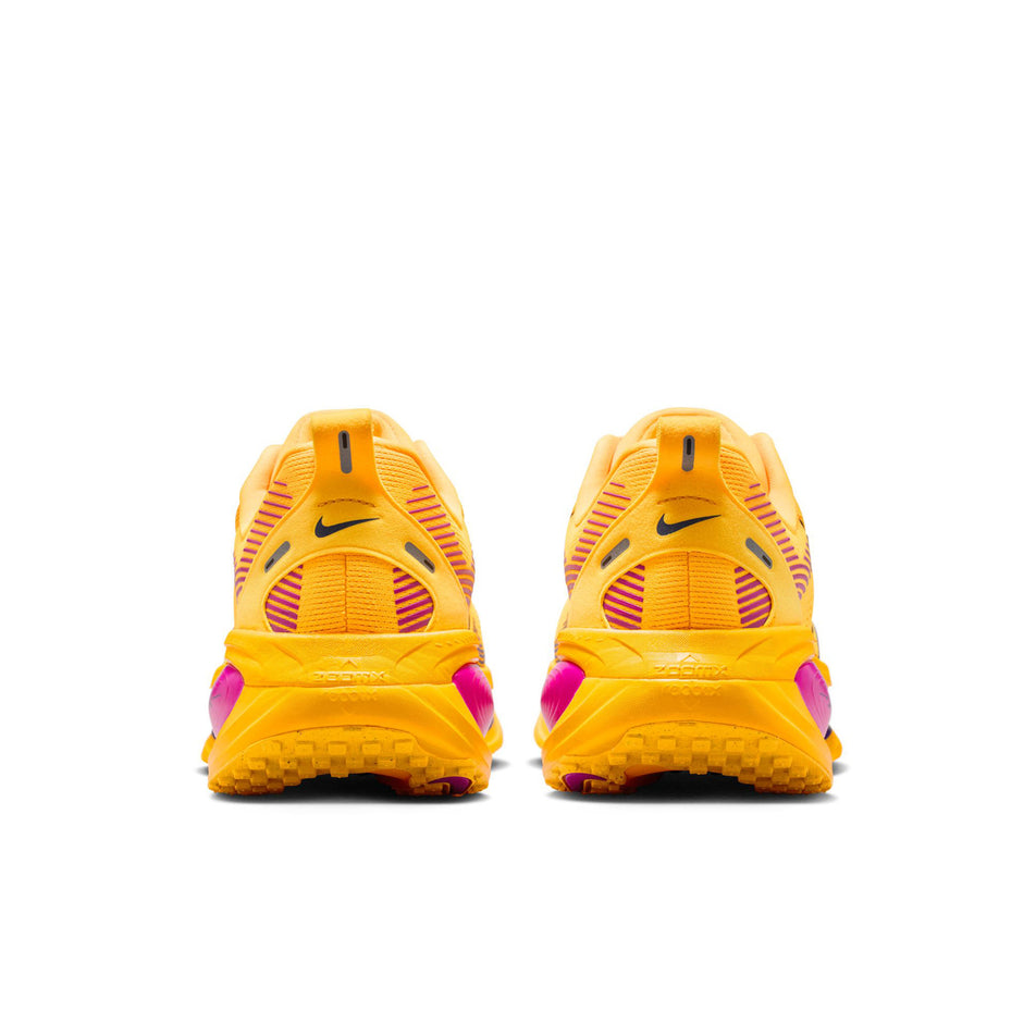 The back of a pair of Nike Men's Vomero 18 Road Running Shoes in the Citron Pulse/Blue Void-laser Orange colourway.