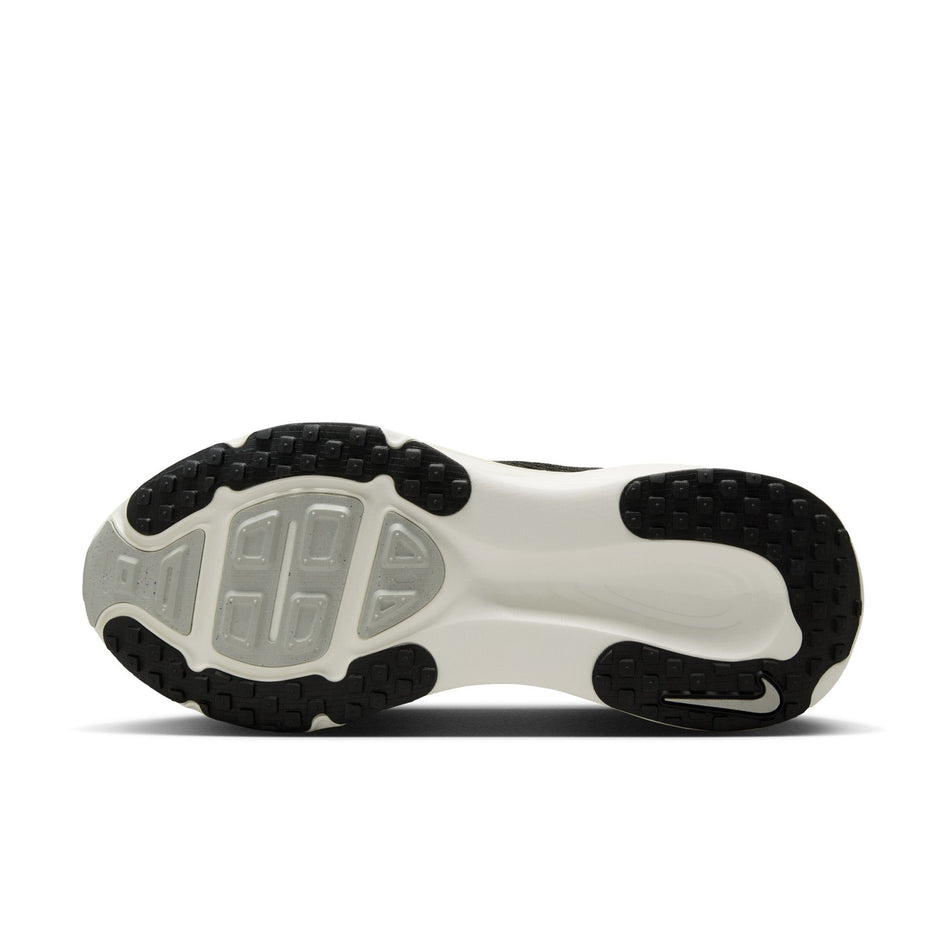 The outsole of the left shoe from a pair of Nike Women's Vomero 18 Road Running Shoes in the Black/Summit White-Coconut Milk colourway. (8686787657890)