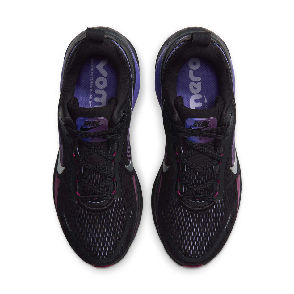 The uppers of a pair of Nike Women's Vomero 18 Road Running Shoes in the Black/Metallic Silver-Persian Violet colourway.