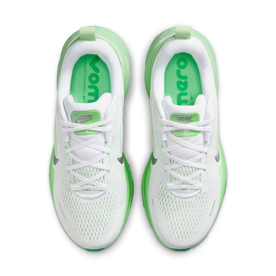 The uppers of a pair of Nike Women's Vomero 18 Road Running Shoes in the White/Metallic Silver-Illusion Green colourway.