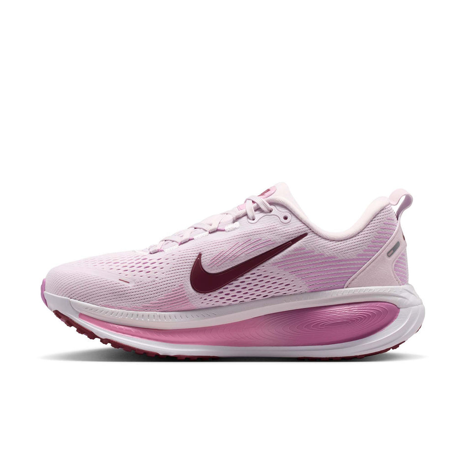 Medial view of the right shoe from a pair of Nike Women's Vomero 18 Road Running Shoes in the Bleached Lilac/Pink Smoke-Light Magenta colourway.