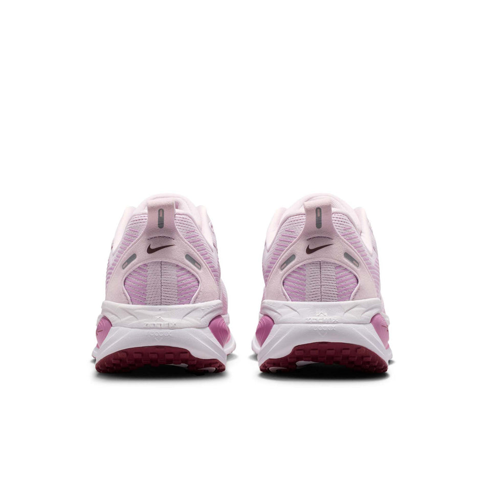 The back of a pair of Nike Women's Vomero 18 Road Running Shoes in the Bleached Lilac/Pink Smoke-Light Magenta colourway.