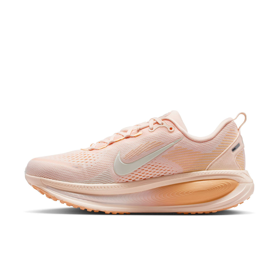 Medial view of the right shoe from a pair of Nike Women's Vomero 18 Road Running Shoes in the Guava Ice/Sail-Orange Chalk colourway.