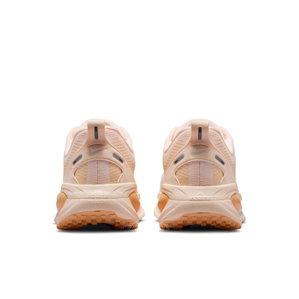 The back of a pair of Nike Women's Vomero 18 Road Running Shoes in the Guava Ice/Sail-Orange Chalk colourway.