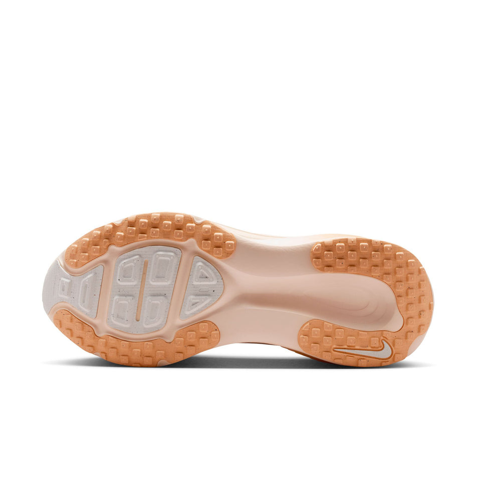 The outsole of the left shoe from a pair of Nike Women's Vomero 18 Road Running Shoes in the Guava Ice/Sail-Orange Chalk colourway.