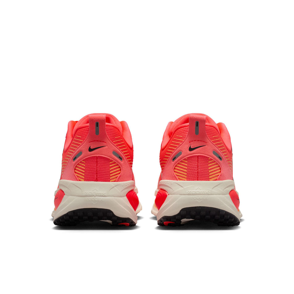 The back of a pair of Nike Women's Vomero 18 Road Running Shoes in the Hot Lava/Black-Chalk-Orange Pulse colourway.