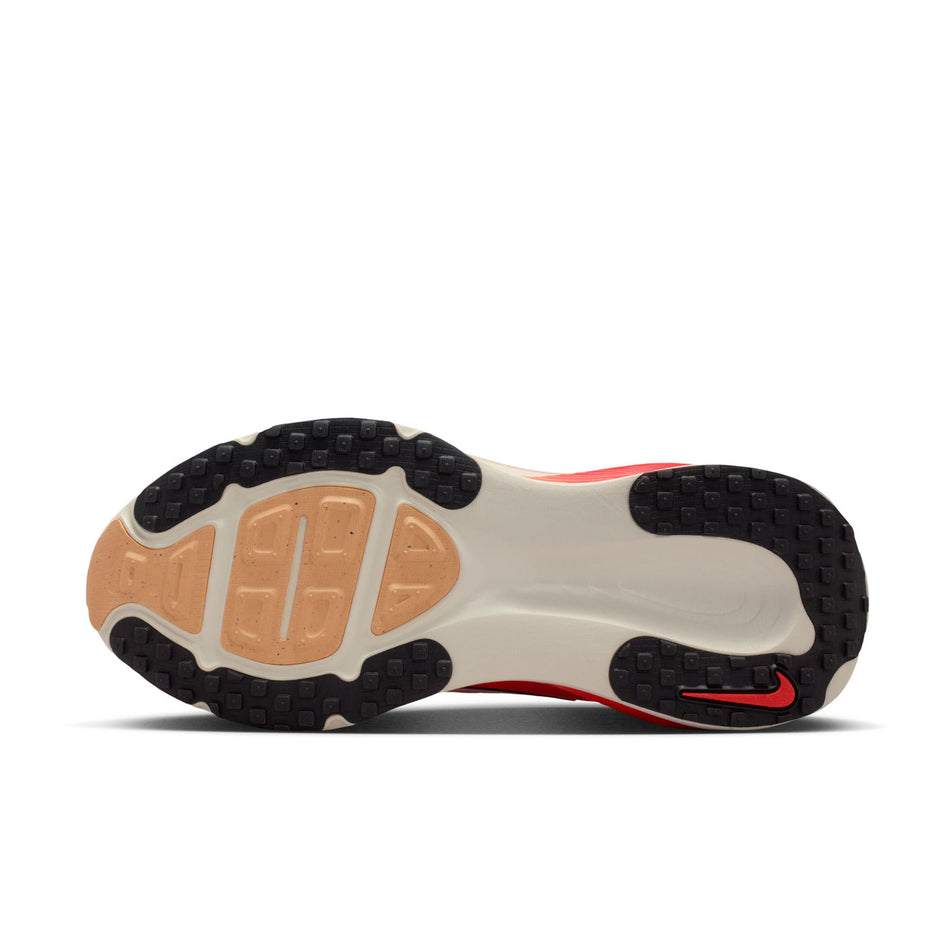 The outsole of the left shoe from a pair of Nike Women's Vomero 18 Road Running Shoes in the Hot Lava/Black-Chalk-Orange Pulse colourway.