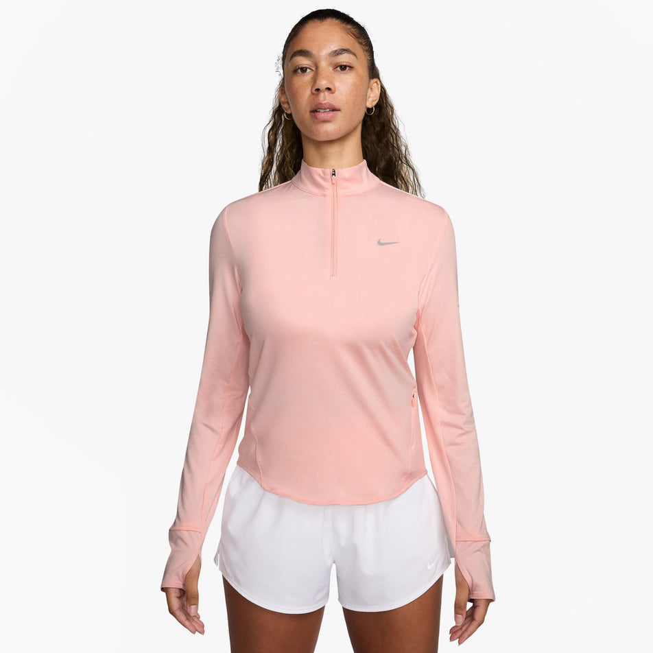 Front view of a model wearing the Nike Women's Swift Dri-FIT UV 1/4-Zip Long Sleeve Running Top in the Atmosphere/Heather/Reflective Silver colourway. (8621654081698)